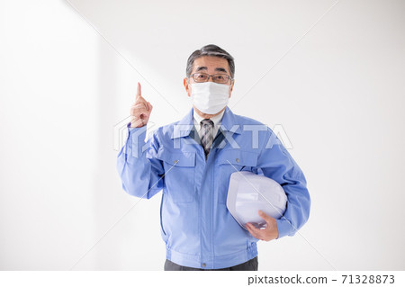 Business image A man posing in work clothes 71328873