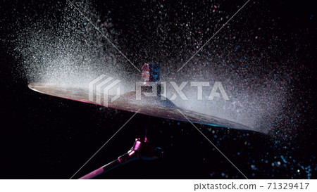 Freeze motion of cymbal with water splashes 71329417
