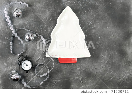 empty christmas tree shaped plate on holiday background. empty christmas tree shaped plate on holiday background. 71330711