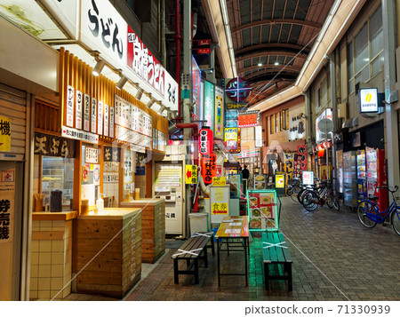 Dusk in the shopping district of Kyobashi, Osaka 71330939