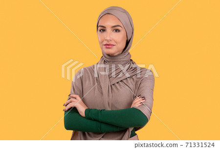 Successful Modern Muslim Woman In Hijab Posing Standing In Studio 71331524