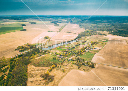 Vasilyovka, Dobrush District, Gomel Region, Belarus. Aerial View Of Small Village With Wooden Houses At Spring Day. Beautiful Rural Landscape In Bird's-eye View Vasilyovka, Dobrush District, Gomel Region, Belarus. Aerial View Of Small Village With Wooden Houses At Spring Day. Beautiful Rural Landscape In Bird's-eye View 71331901