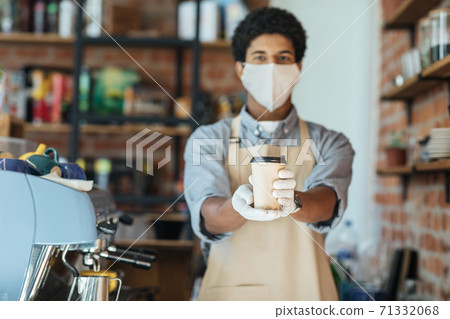 Bar owner works only with take away orders during corona virus outbreak, healthcare and food drink concept 71332068