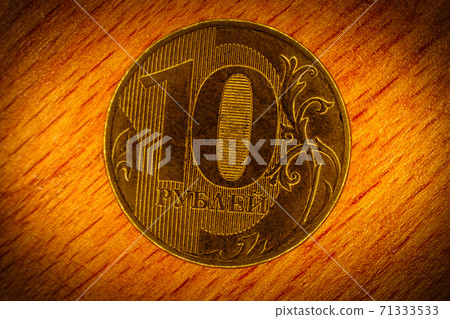 Ten rubles coin with inscription in Russian language - 10 rubles, macro picture Ten rubles coin with inscription in Russian language - 10 rubles, macro picture 71333533