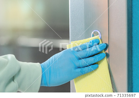 Sanitizing an elevator push button against bacteria and virus. Sanitizing an elevator push button against bacteria and virus. 71335697