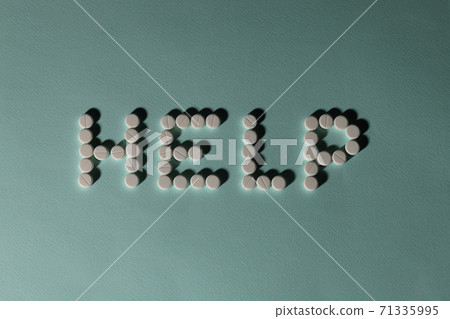 Inscription from pills help on blue background. M Inscription from pills help on blue background. M 71335995