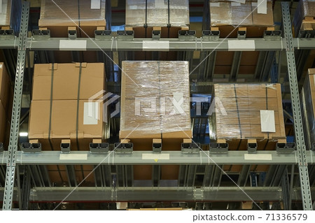 Warehouse with stocked shelves of boxes Warehouse with stocked shelves of boxes 71336579