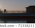 Bicycle rider in the sunset 71338211