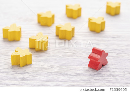 Among others, a red wooden figure in the shape of a man stands out. Number one. Leadership skills. Boss. CEO. Bright table. The concept of management and the influence of the leader on the team Among others, a red wooden figure in the shape of a man stands out. Number one. Leadership skills. Boss. CEO. Bright table. The concept of management and the influence of the leader on the team 71339605