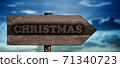 christmas sign on wood arrow 71340723