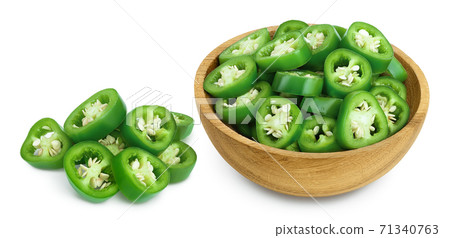 sliced jalapeno pepper in wooden bowl isolated on white background. Green chili pepper with clipping path and full depth of field. 71340763