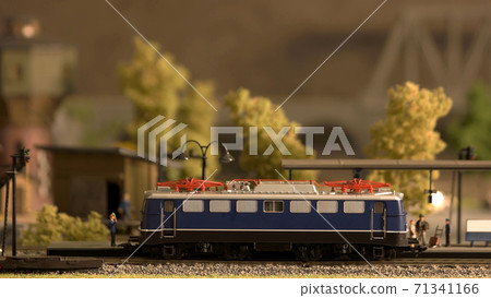 Miniature retro train model on a station. Miniature retro train model on a station. 71341166