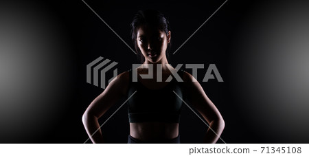 TaeKwonDo Karate teenager athlete kick punch black background isolated 71345108