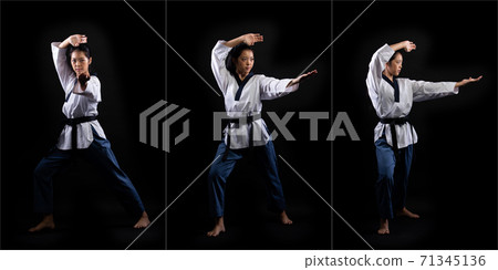 TaeKwonDo Karate teenager athlete kick punch black background isolated 71345136
