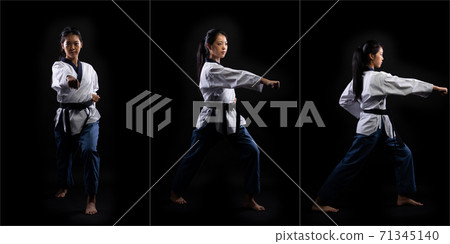 TaeKwonDo Karate teenager athlete kick punch black background isolated 71345140