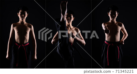 TaeKwonDo Karate teenager athlete kick punch black background isolated 71345221
