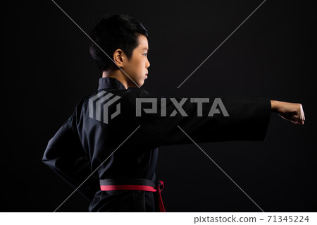 TaeKwonDo Karate teenager athlete kick punch black background isolated TaeKwonDo Karate teenager athlete kick punch black background isolated 71345224