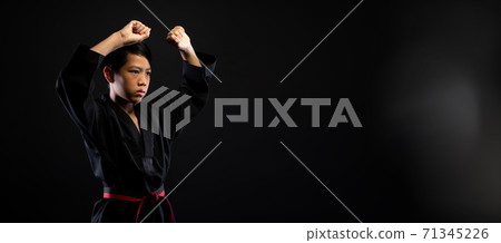 TaeKwonDo Karate teenager athlete kick punch black background isolated TaeKwonDo Karate teenager athlete kick punch black background isolated 71345226