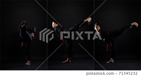 TaeKwonDo Karate teenager athlete kick punch black background isolated 71345232