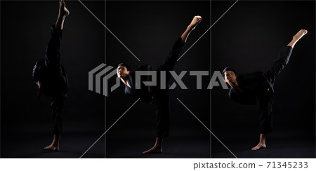 TaeKwonDo Karate teenager athlete kick punch black background isolated 71345233