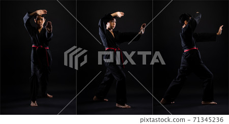 TaeKwonDo Karate teenager athlete kick punch black background isolated 71345236
