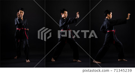 TaeKwonDo Karate teenager athlete kick punch black background isolated 71345239