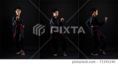 TaeKwonDo Karate teenager athlete kick punch black background isolated 71345240