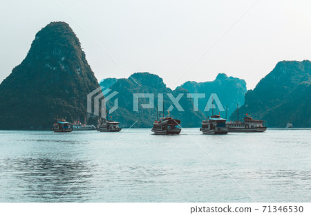 Rock islands near floating village in Halong Bay. Beautiful sea landscape in Ha Long Bay Vietnam Rock islands near floating village in Halong Bay. Beautiful sea landscape in Ha Long Bay Vietnam 71346530