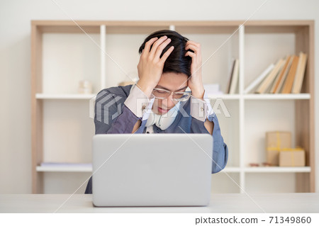 desperate student exam failure stressed asian guy 71349860