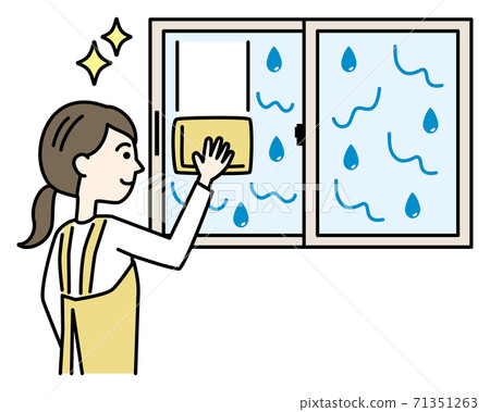 A woman in an apron wiping a window wet with condensation A woman in an apron wiping a window wet with condensation 71351263