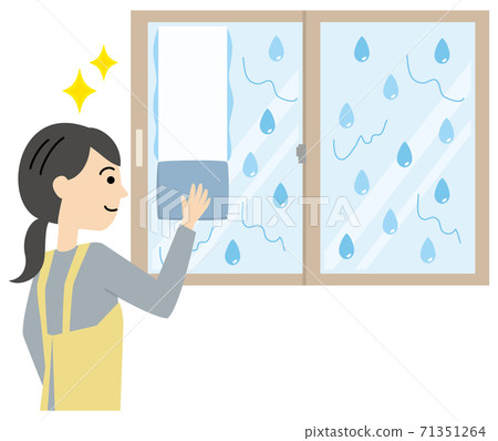 A woman in an apron wiping a window wet with condensation A woman in an apron wiping a window wet with condensation 71351264