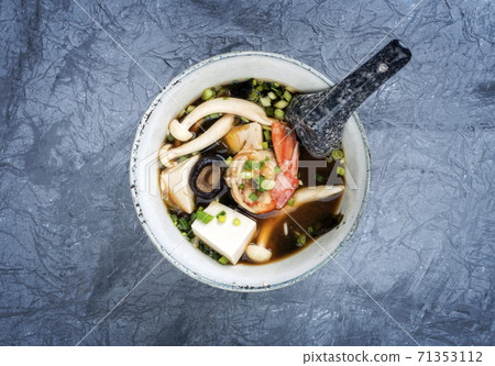 Traditional Japanese miso soup with king prawns and tofu  71353112