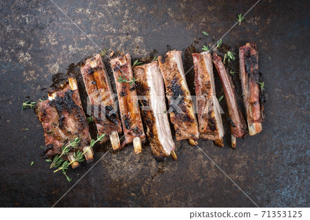 Barbecue spare ribs St Louis style with hot honey chili marinade sliced Barbecue spare ribs St Louis style with hot honey chili marinade sliced 71353125