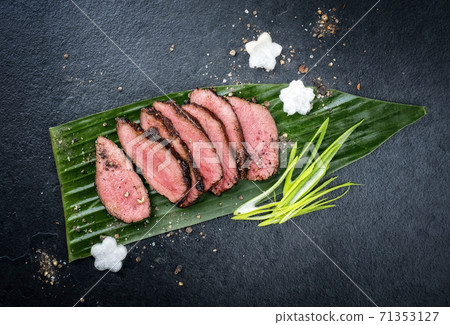 barbecue wagyu dry aged fillet steak slices with daikon and leek 71353127