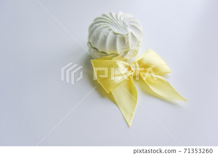selective focus at the light green marshmallow with yellow ribbon selective focus at the light green marshmallow with yellow ribbon 71353260