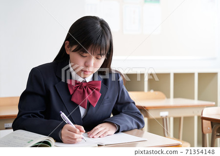 Japanese girls junior high school students studying in the classroom Japanese girls junior high school students studying in the classroom 71354148
