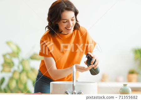 Person is washing hands Person is washing hands 71355682