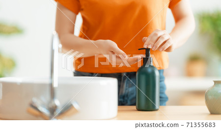 Person is washing hands Person is washing hands 71355683