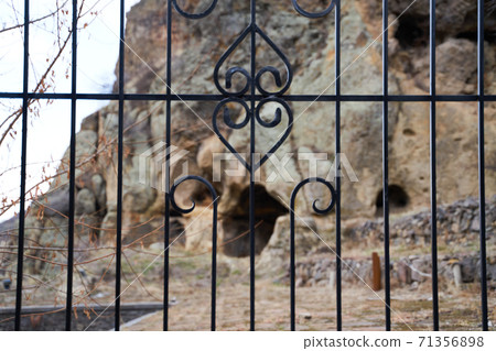 View through the fence near the Geghard Monastery 71356898