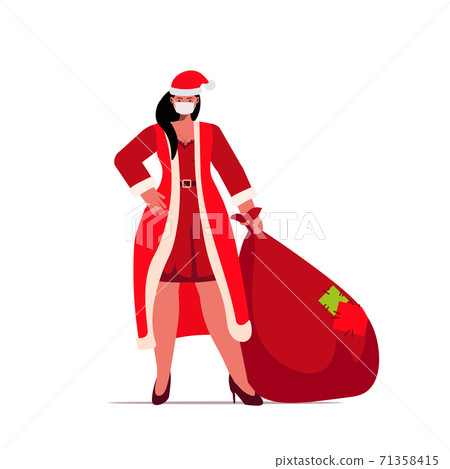 santa woman in mask holding sack full of gifts new year christmas holidays celebration coronavirus quarantine 71358415