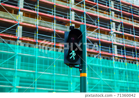 Pedestrian crossing traffic light with green man Pedestrian crossing traffic light with green man 71360042