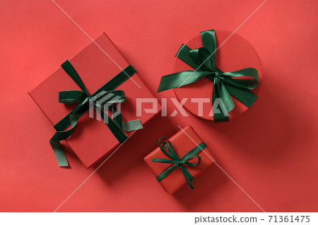 Christmas three gift boxes on red. Christmas three gift boxes on red. 71361475