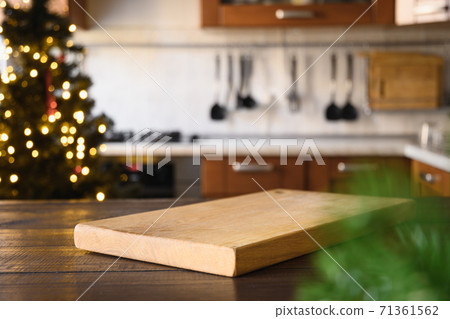Wooden tabletop with cutting board for Christmas. 71361562