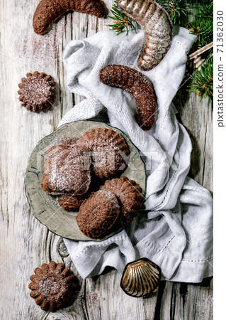 Christmas shortcrust cookies chocolate crescents with fir tree, molds, xmas decorations. Top view Christmas shortcrust cookies chocolate crescents with fir tree, molds, xmas decorations. Top view 71362030