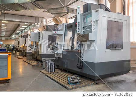 a number of CNC machines in the production room. Interior of industrial premises 71362085