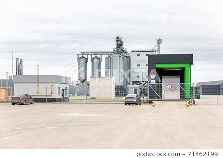 modern agricultural enterprise appearance. Industrial buildings made of galvanized metal, cloudy day 71362199