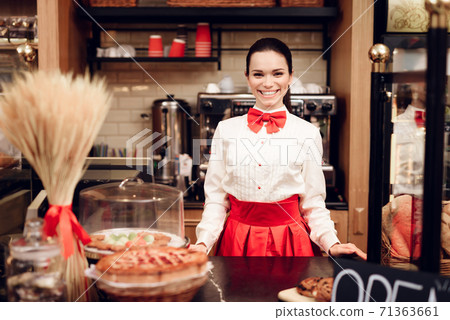 Young Smiling Woman Standing in Modern Bakery. 71363661