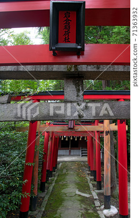 A traditional Japanese gate as the entrance of a Shinto shrine. A traditional Japanese gate as the entrance of a Shinto shrine. 71363932