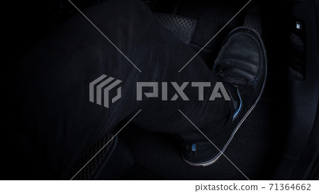 Close up images of man driving car by pushing accelerator and brake pedal with right foot black leather shoe and black jean pant. camera shot inside the japanese car. 71364662