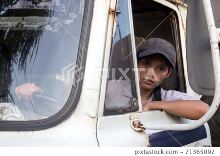 woman truck driver in the car 71365092
